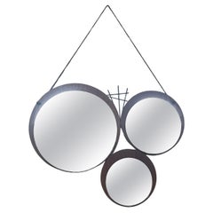 1960s mirror with geometrically patterned teak base