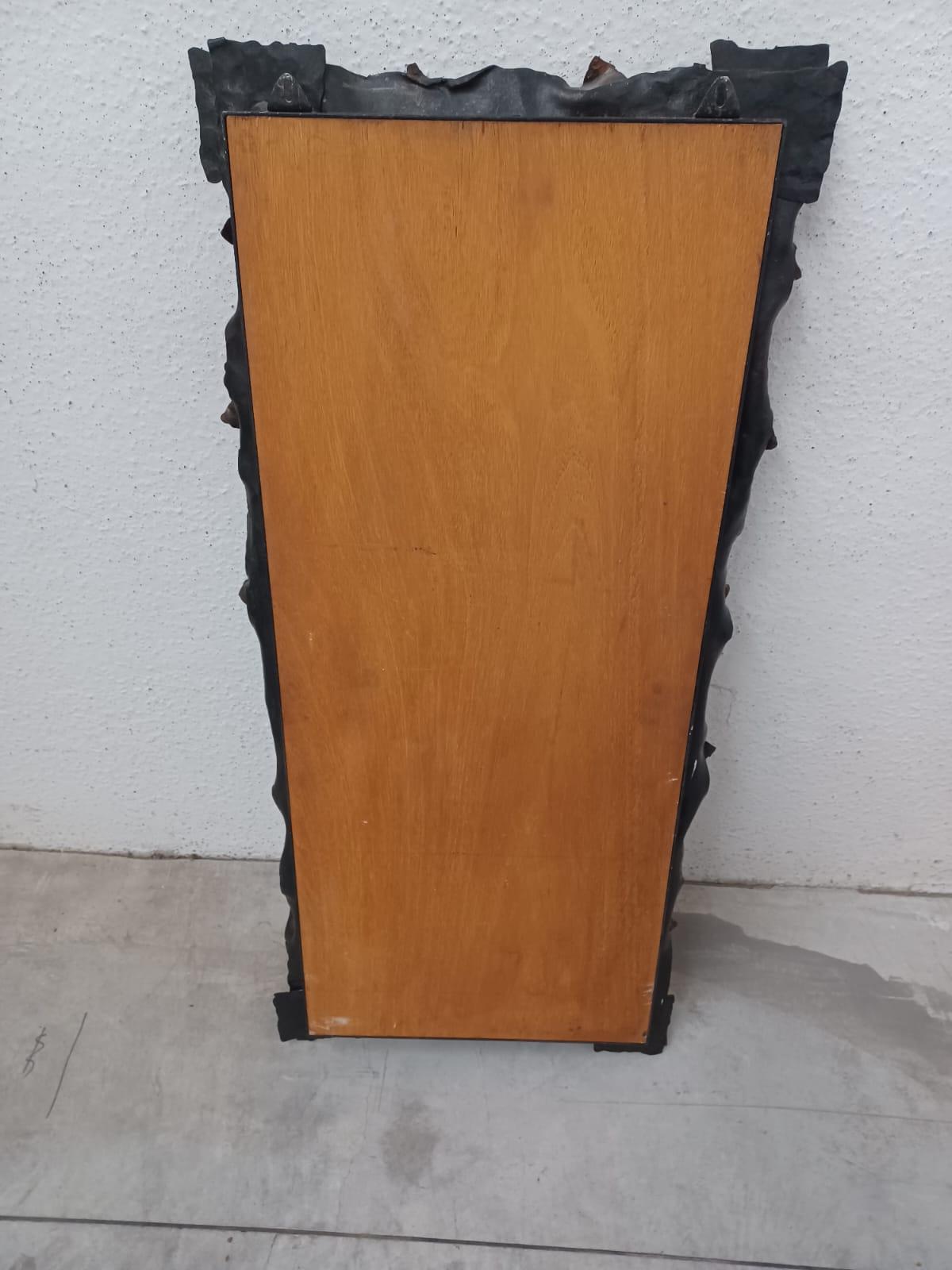 1960s mirror  iron cast in Murano glass. Wooden back. Very good conditions.