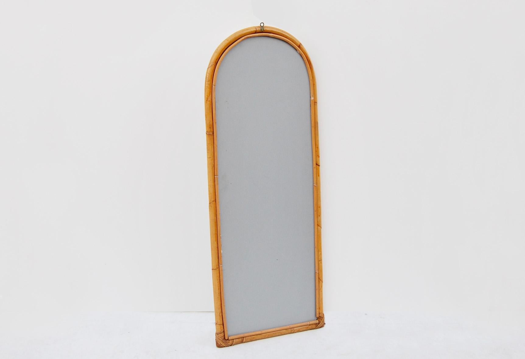 Italian Arched wall mirror, bamboo and rattan, Year 1960  For Sale