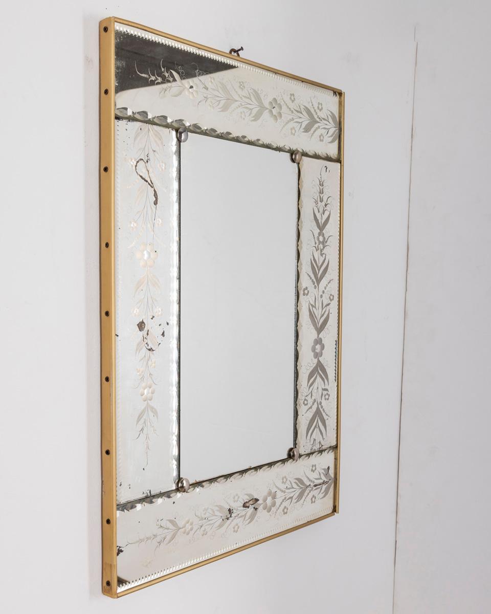 Wall mirror with gilt metal frame and decorated glass Italian design, 1950s.

CONDITION: In good condition, shows signs of wear given by time.

DIMENSIONS: Height 74 cm; Width 51 cm; Length 3 cm

MATERIAL: Metal and Glass

YEAR OF PRODUCTION: Anni 50