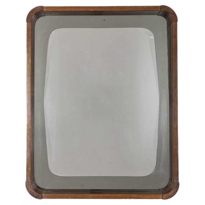 Miroir mural avec cadre en bois et verre fumé, design italien, années 1960.

CONDITION :
En bon état, présente des signes d'usure dus à l'âge.

DIMENSIONS :
Hauteur 70 cm ; largeur 55 cm ; profondeur 5 cm ;

MATÉRIAUX :
Bois et verre.

ANNÉE DE