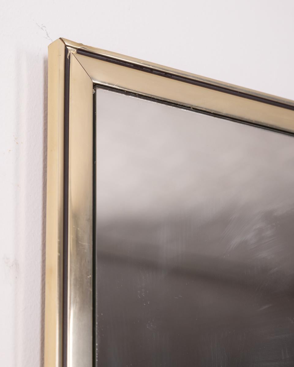 Wall mirror with double clear and smoked glass, with silver-plated metal frame, 1970s, Italian design.

CONDITION: In good condition, shows signs of wear given by time.

DIMENSIONS: Height 100 cm; Width 50 cm; Length 2 cm

MATERIAL: Metal, Silver