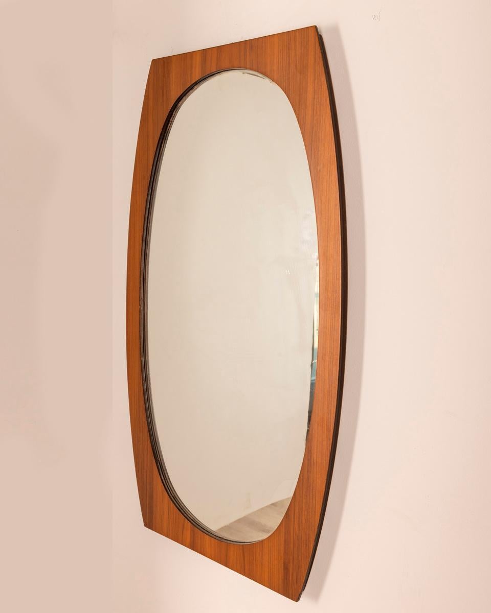 Wall mirror with walnut wood frame , design Gianfranco Frattini, 1970s.

CONDITION: In good condition, may show signs of wear given by time.

DIMENSIONS: Height 100 cm; width 58 cm; length 3.5 cm;

MATERIAL: Wood and glass

YEAR OF PRODUCTION: Anni