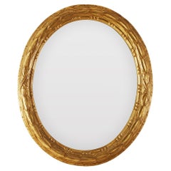 Italian Oval Carved and Gilded Leaf Mirror Mid-20th Century