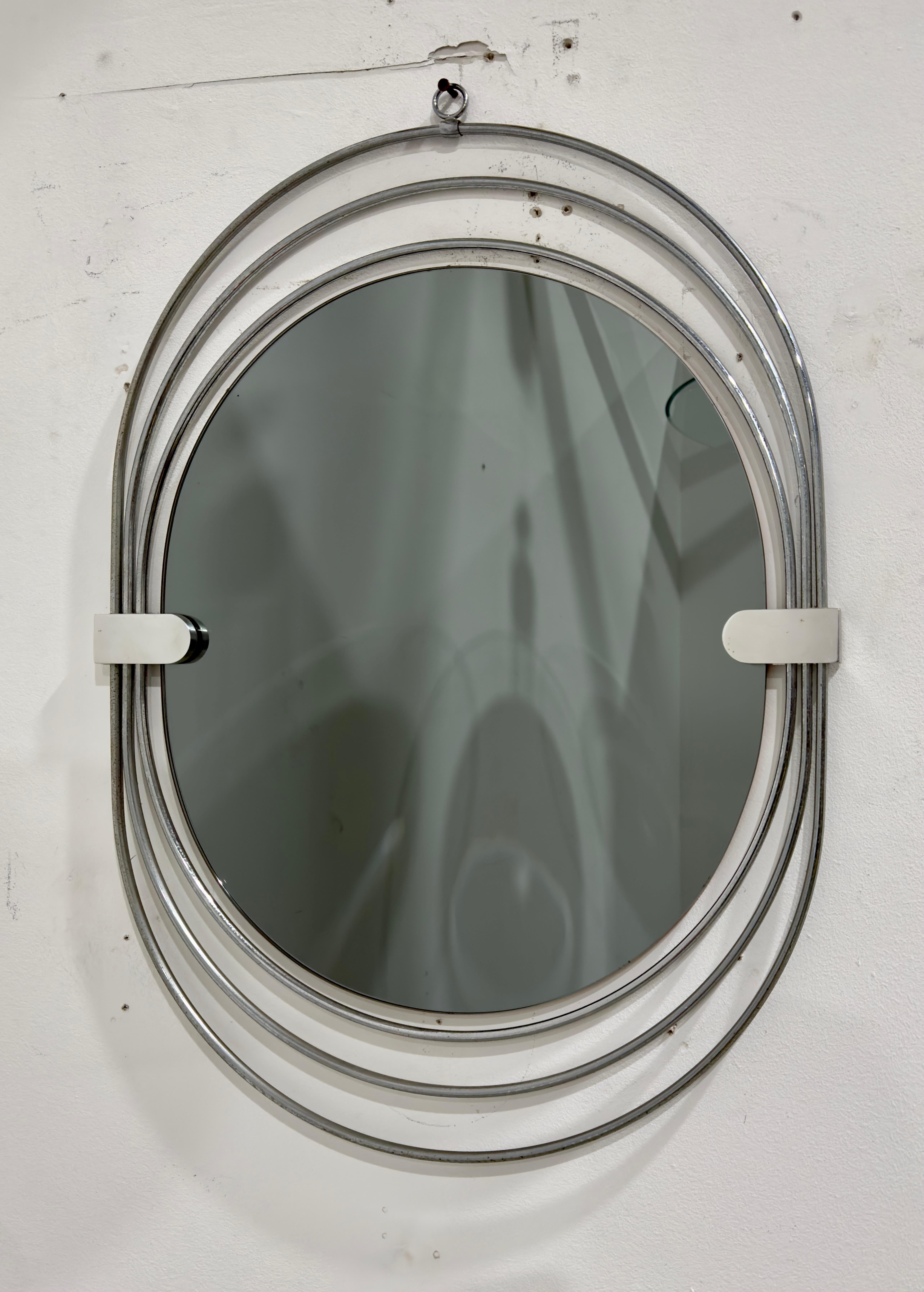 Postmodern mirror with triple chrome metal frame and mirrored glass. Italian Manufacture, 1970s