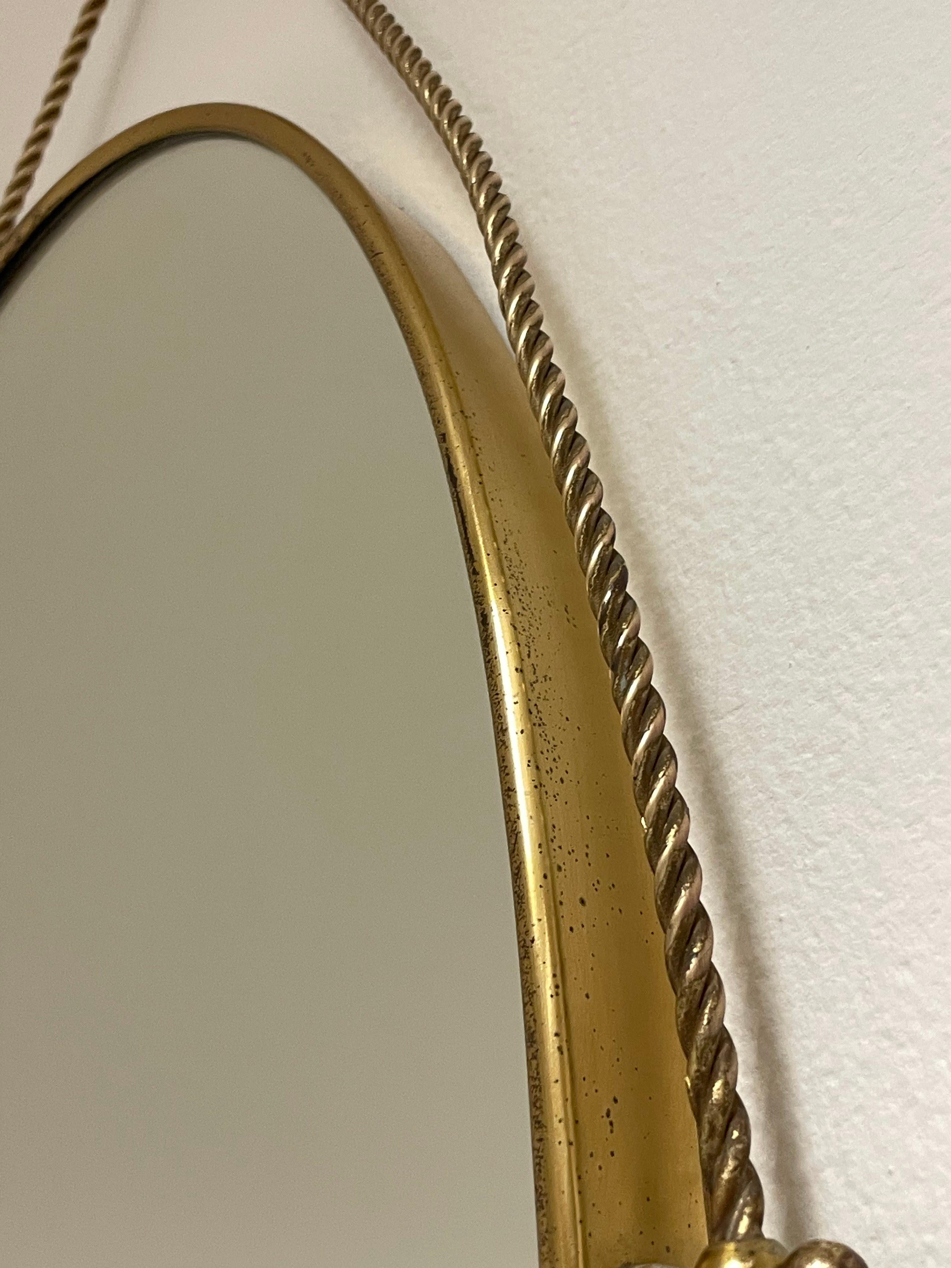 Oval mirror with brass frame and motif 1950s, Italian manufacture For Sale 9