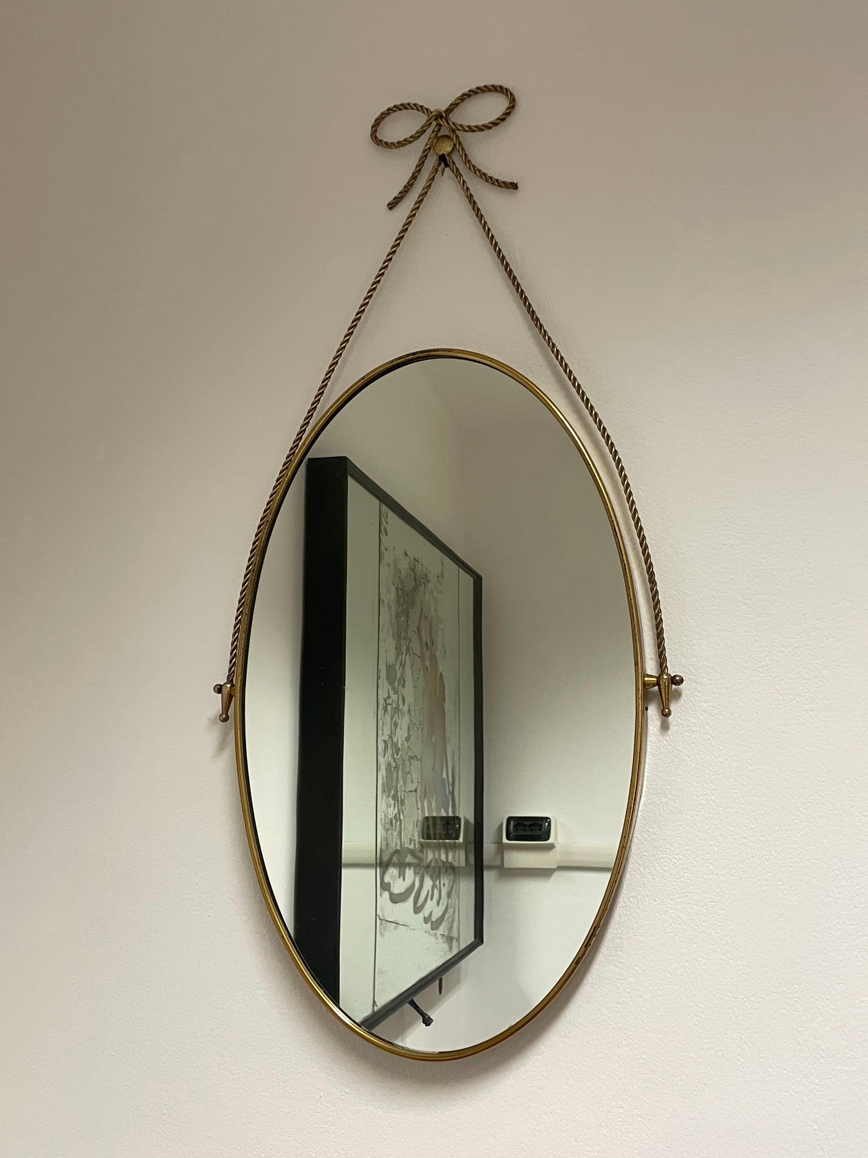 Mid-Century Modern Oval mirror with brass frame and motif 1950s, Italian manufacture For Sale