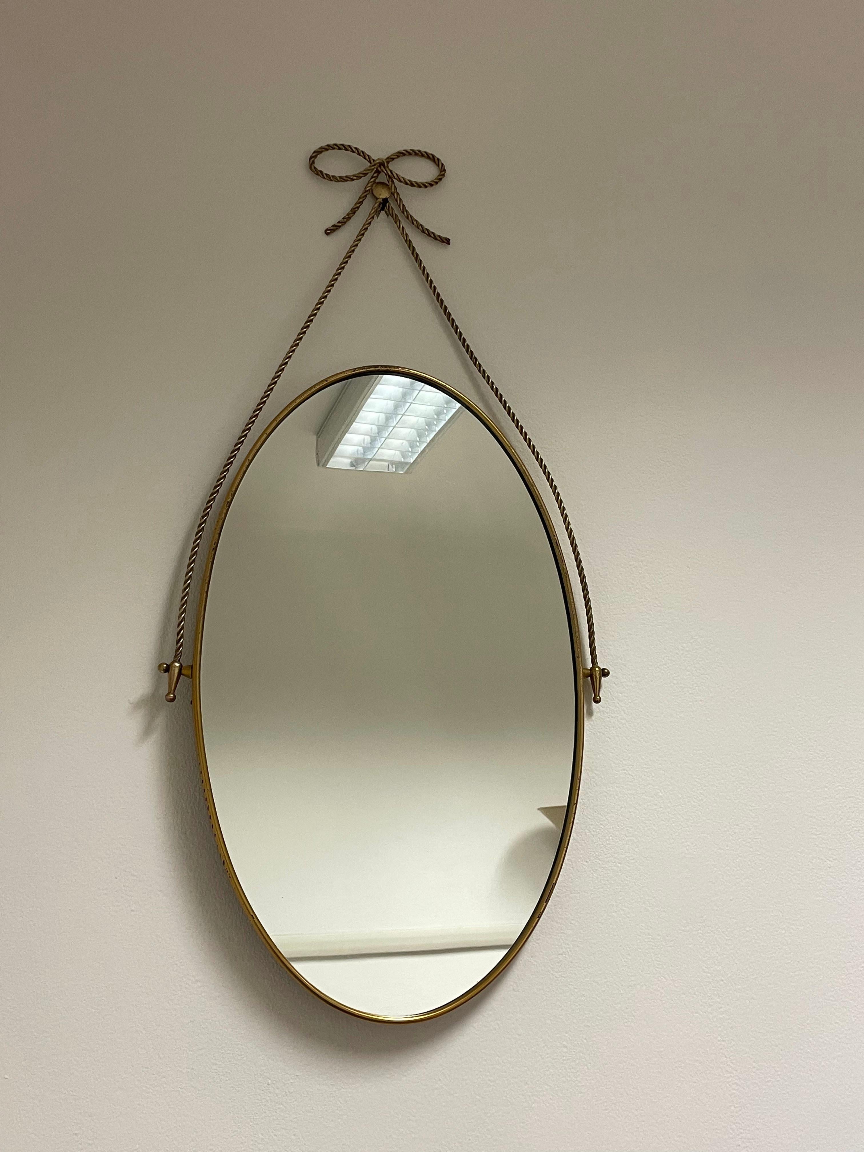 Mid-20th Century Oval mirror with brass frame and motif 1950s, Italian manufacture For Sale