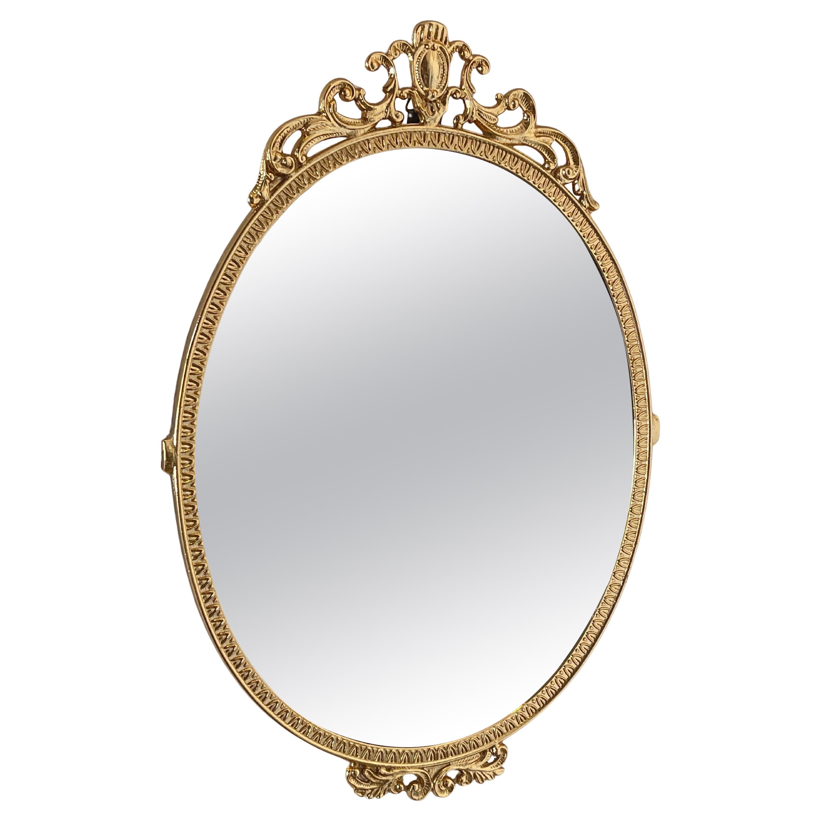 Specchio ovale dorato con cornice decorata - Eleganza classica italiana