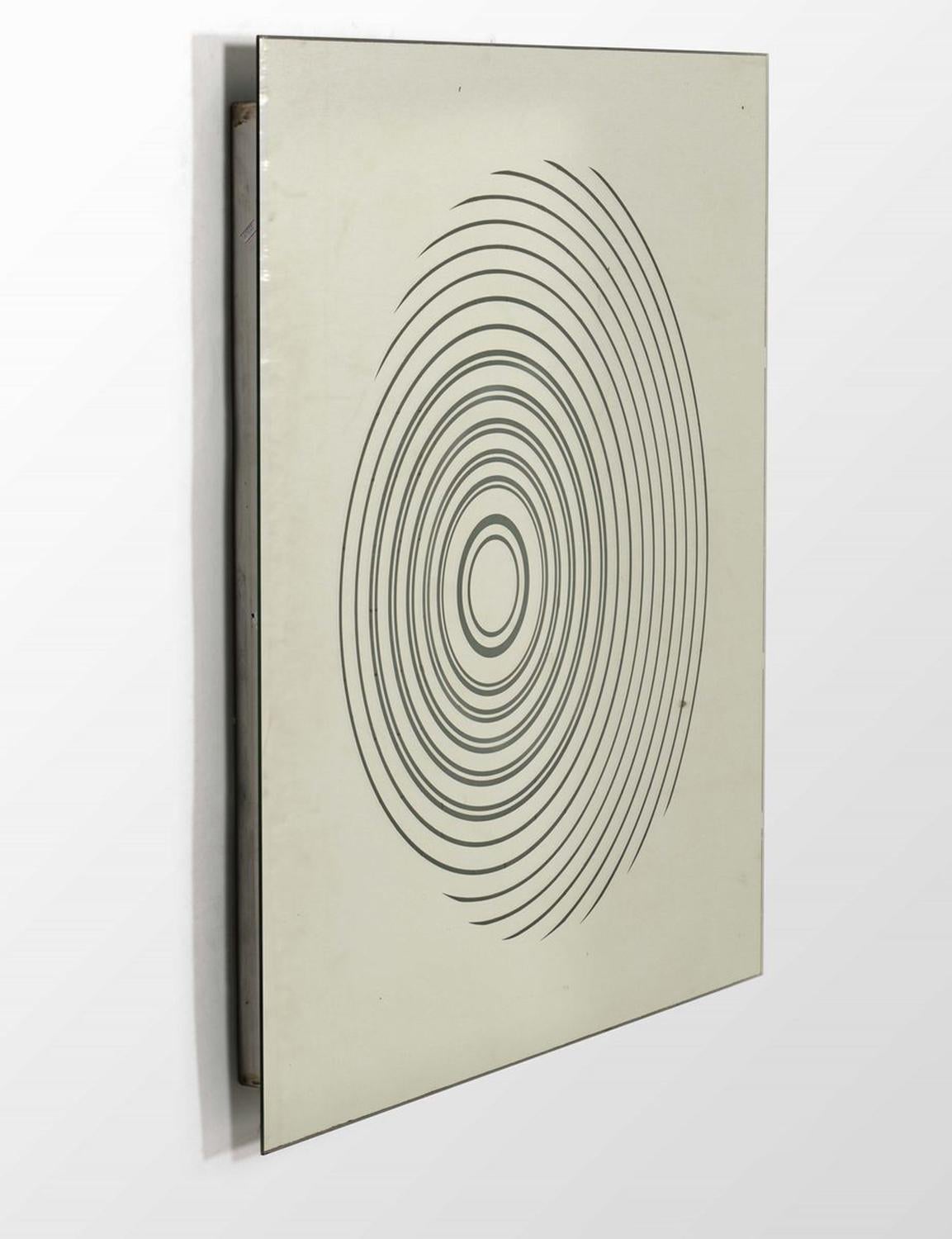 Backlit Mirror with Optical Serigraphs, Italy 1970s. This mirror is not only a functional object, but a true sculptural element, featuring an abstract optical motif embossed on its surface. Backlighting creates a dramatic effect, accentuating the