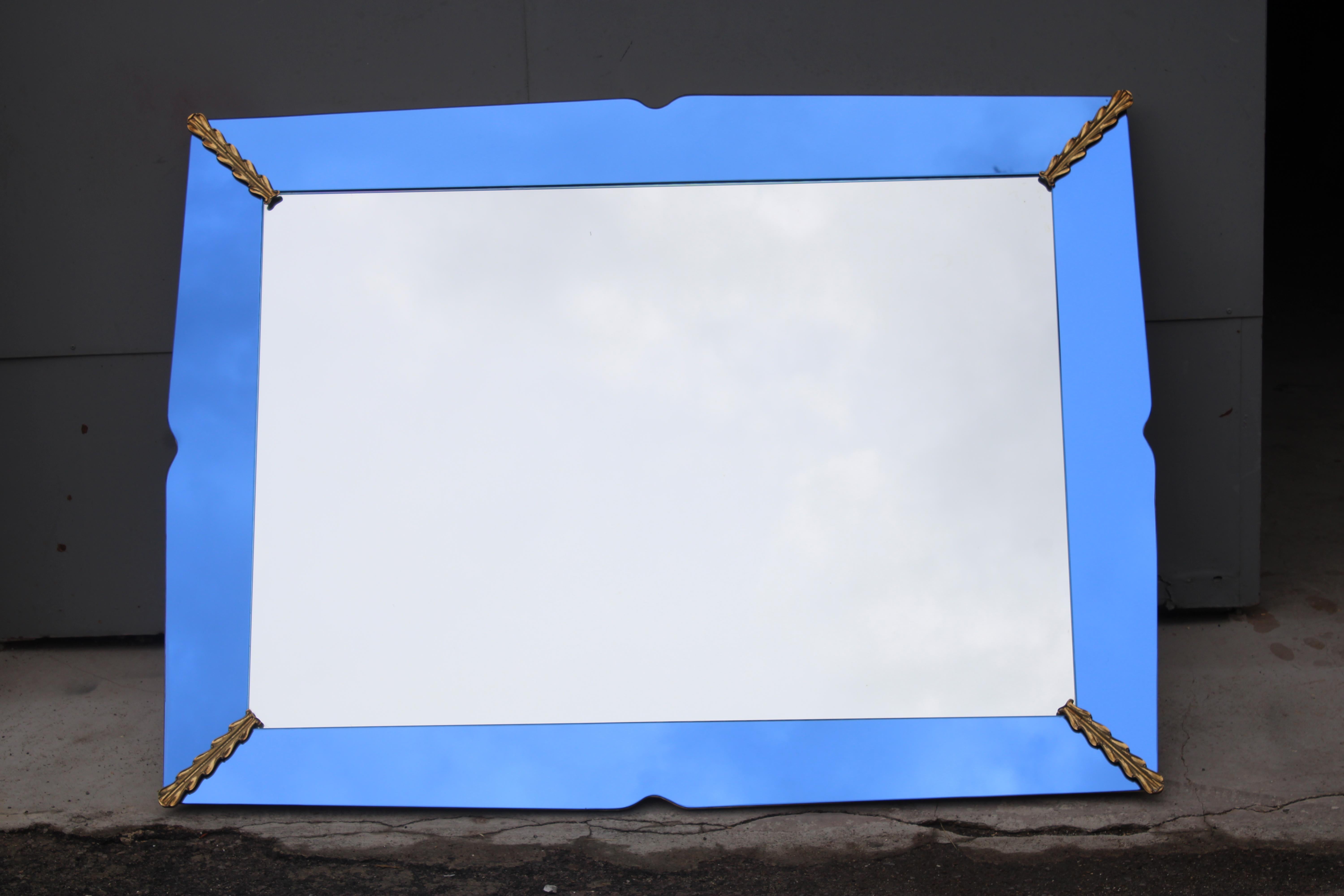 Particular mirror with Cobalt Blue glass plate with Brass parts, lacquered wooden frame. Fontana Arte Pietro Chiesa Design.