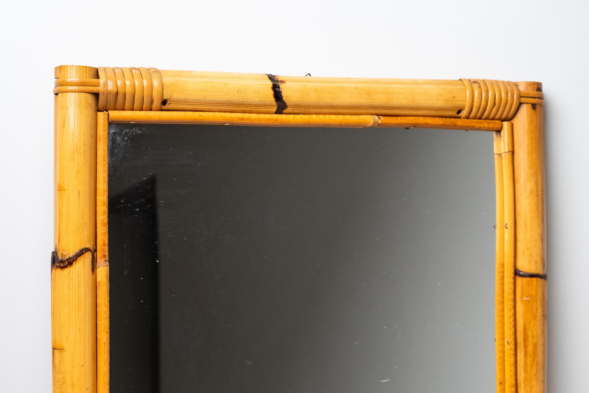 Rectangular Bamboo Mirror, Made in Italy, 1970s. 
Beautiful rectangular mirror handmade of bamboo and rattan. It is in excellent condition and retains the patina of time. 
The price of shipping is for the Italian territory, for the islands and for