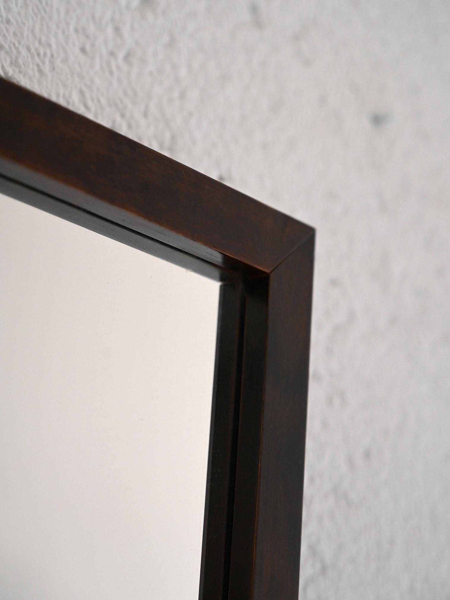 Vintage 1960s rectangular mirror.                                                                                                                                                                   A piece of furniture that stands out for its