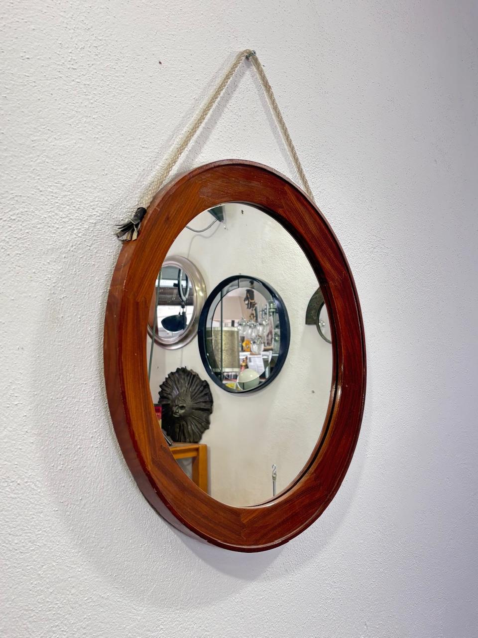 Mid-century Scandinavian Design 1960's Modern antique Teak mirror.

In good conservative condition, no cosmetic or structural defects to report, only slight and obvious signs of time due to use and age. (Please see photos)

Diameter 60cm