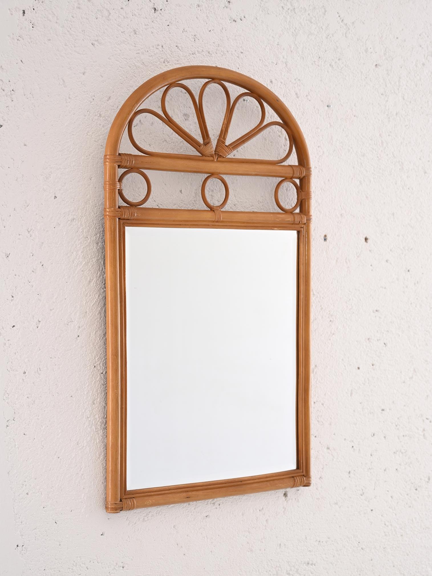 Furnishing item of Scandinavian origin original vintage. 

The mirror frame is made entirely of bamboo, a lightweight and durable material that lends a cozy and warm atmosphere to the room. 
What makes this frame truly special is its top decoration.