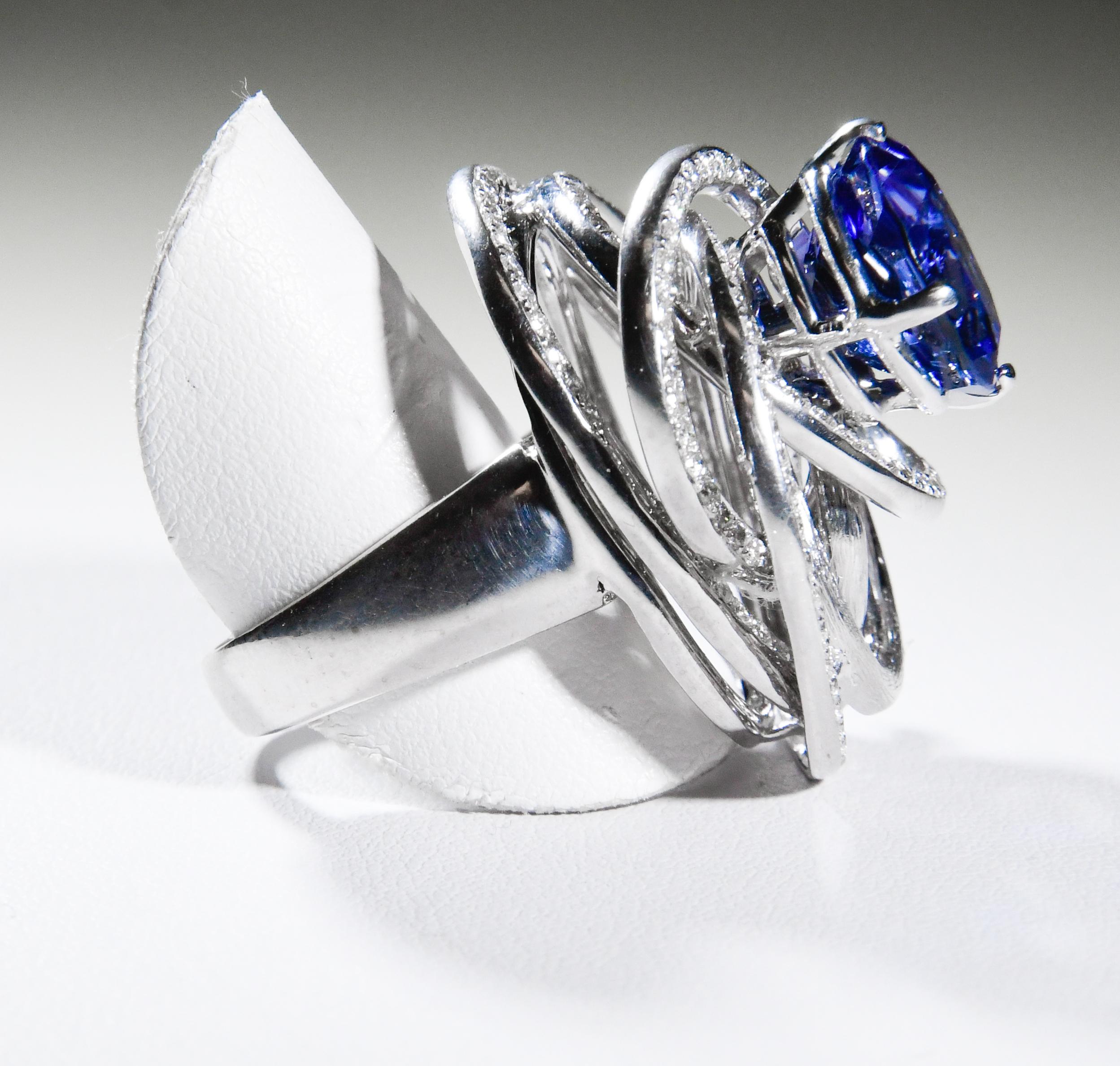 Contemporary Special 18K White Terrific Tanzanite and Diamond Swirls Ring For Sale