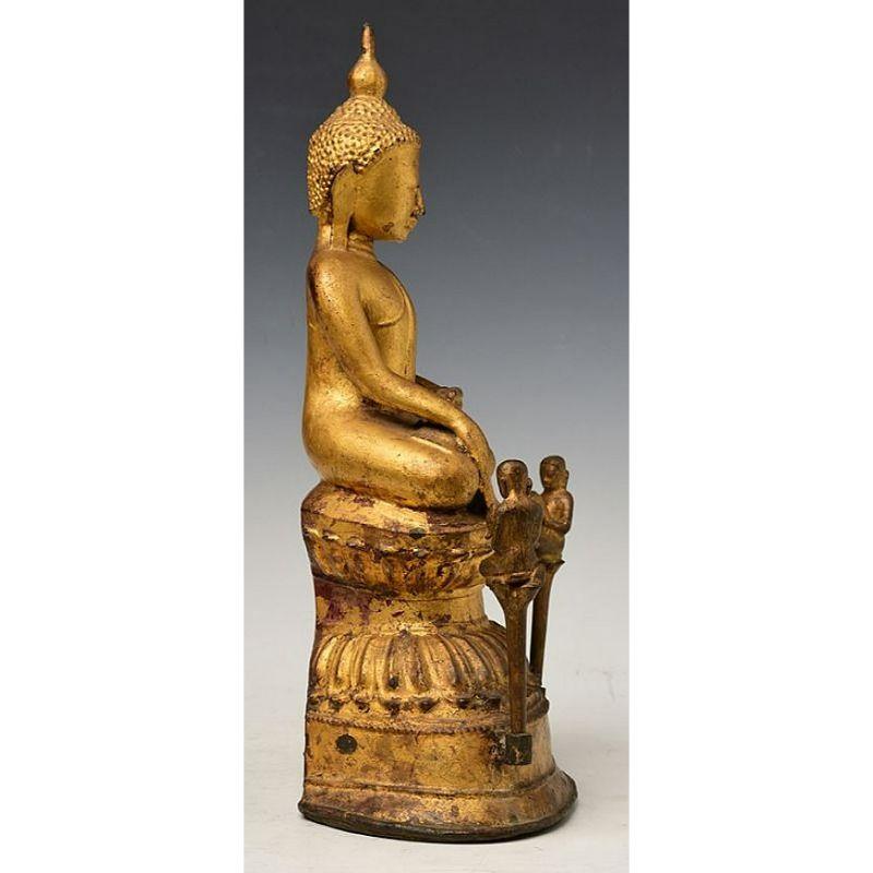 Material: bronze
Measures: 39 cm high 
19,7 cm wide
Weight: 4.281 kgs
Gilded with 24 krt. gold
Shan (Tai Yai) style
Bhumisparsha mudra
Originating from Burma
17-18th century
With two seperate monks
Very high quality !

