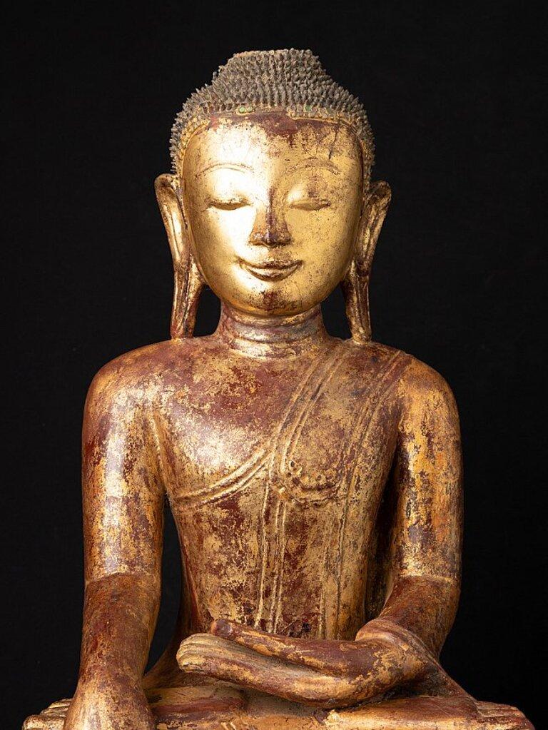 Material: lacquerware
63,9 cm high 
42,4 cm wide and 33,3 cm deep
Weight: 7.35 kgs
Gilded with 24 krt. gold
Ava style
Bhumisparsha mudra
Originating from Burma
17th century
Very hiqh quality !
One of the best faces that I have ever seen on a Burmese