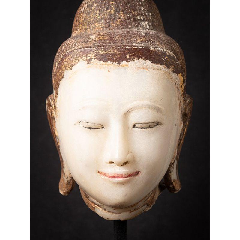 Material: marble
44 cm high 
21 cm wide and 21 cm deep
Weight: 16.85 kgs
The marble head is 31 cm high without the base
Mandalay style
Originating from Burma
19th century
With traces of original lacquer and gilding
Very beautiful !

