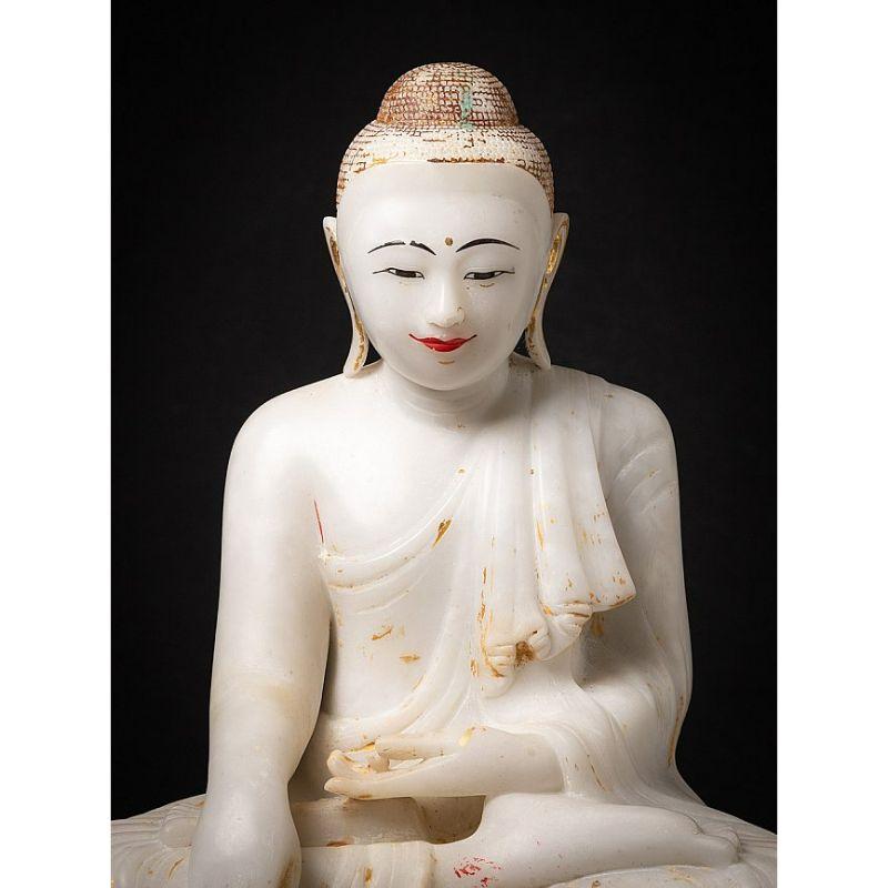 Material: marble
57 cm high 
52 cm wide and 29 cm deep
Weight: 61.55 kgs
Mandalay style
Bhumisparsha mudra
Originating from Burma
19th century
The stone seems more 'alabaster', it is translucent
With Burmese inscriptions in the base, probably the