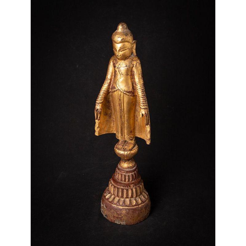 Material: wood
52 cm high 
14,6 cm wide and 12,6 cm deep
Weight: 1.468 kgs
Gilded with 24 krt. gold
Ava style
Originating from Burma
17-18th century

