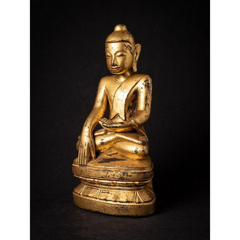 Material: wood
Measures: 41,7 cm high 
21 cm wide and 14,2 cm deep
Weight: 2.618 kgs
Gilded with 24 krt. gold
Mon style
Bhumisparsha mudra
Originating from Burma
18th century
With Burmese inscriptions in the base.

