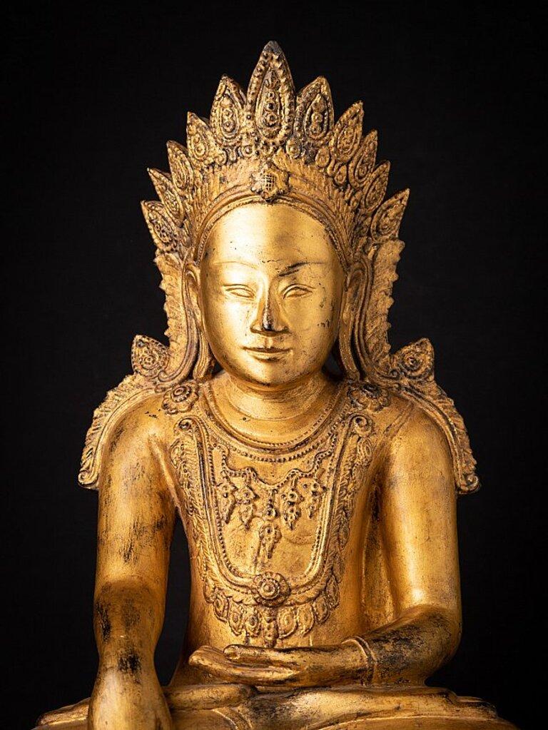 Material: wood
69,5 cm high 
35,6 cm wide and 25 cm deep
Weight: 13.5 kgs
Gilded with 24 krt. gold
Shan (Tai Yai) style
Bhumisparsha mudra
Originating from Burma
Early 19th century
In very good condition - very special !
 