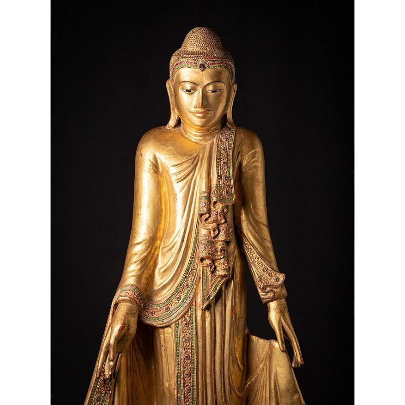 Material: wood
153,5 cm high 
57,5 cm wide and 22 cm deep
Gilded with 24 krt. gold
Mandalay style
Originating from Burma
19th century
With inlayed eyes
Very nice quality - beautiful face !
The height is measured including the black wooden