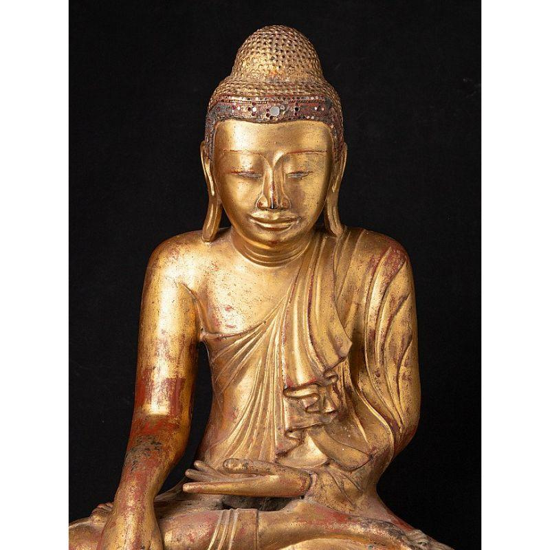 Material: bronze
53 cm high 
43 cm wide and 25 cm deep
Weight: 23.85 kgs
Gilded with 24 krt. gold
Mandalay style
Bhumisparsha mudra
Originating from Burma
19th century
This is probably the most beautiful bronze Mandalay Buddha, ever in my