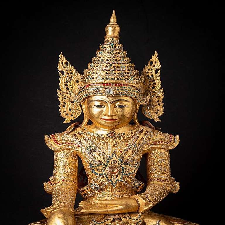 Material: wood
65 cm high 
43 cm wide and 26 cm deep
Weight: 8.1 kgs
Gilded with 24 krt. gold
Mandalay style
Bhumisparsha mudra
Originating from Burma
19th century
With complete decorations / crown
A complete set in this fine condition is extremely