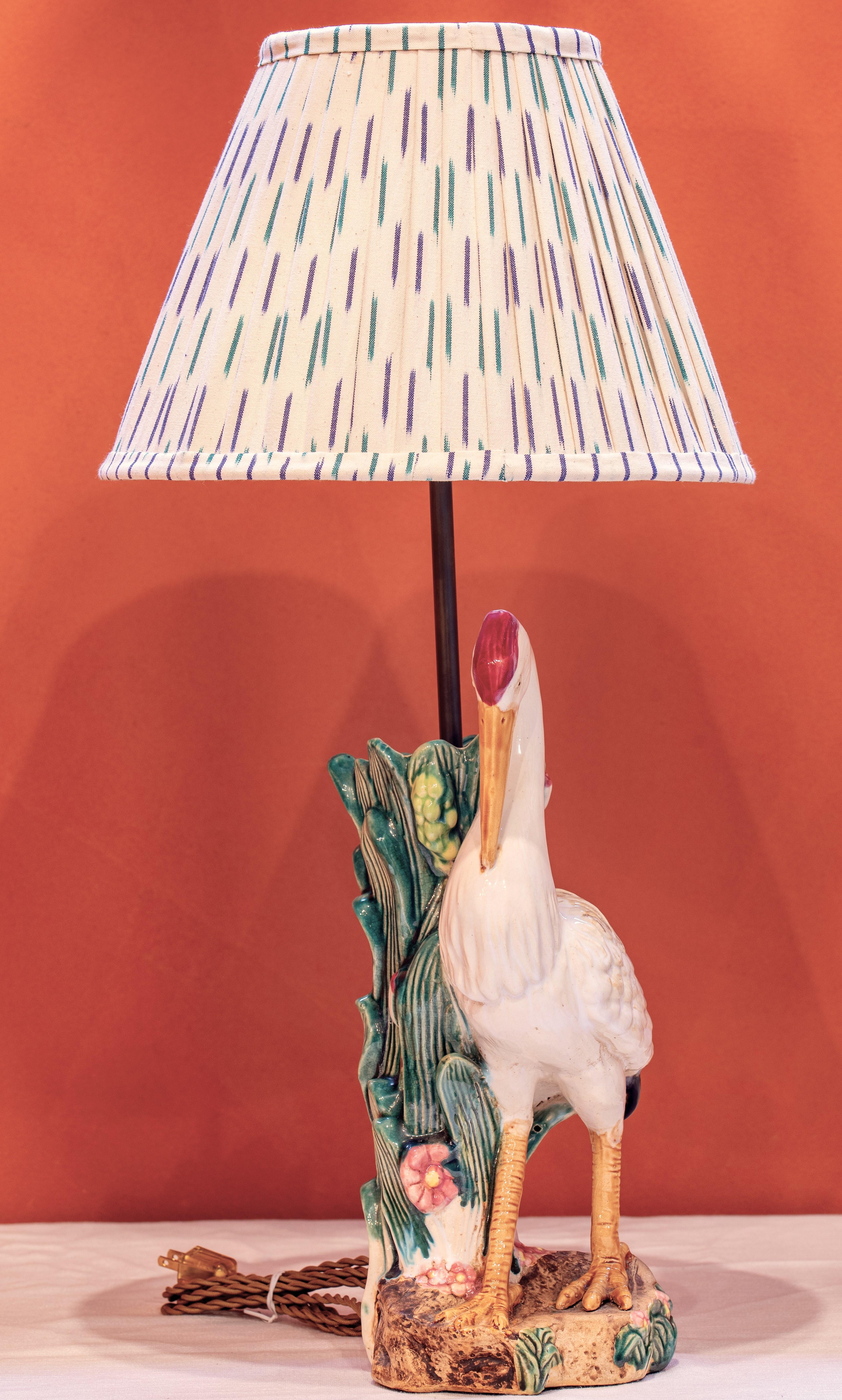 This special lamp was made from an antique majolica vase.  It is an unusual, a one-of-a-kind piece that has both a timeless and charming appeal.  The lamp naturally would be terrific in a coastal home, but could be interesting is most settings.  No