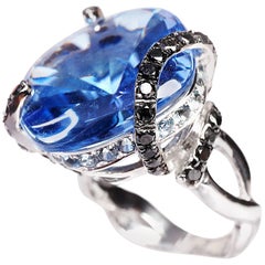 Special Cut 27.78 Carat Blue Topaz Black Diamond Cocktail White Gold Ring
