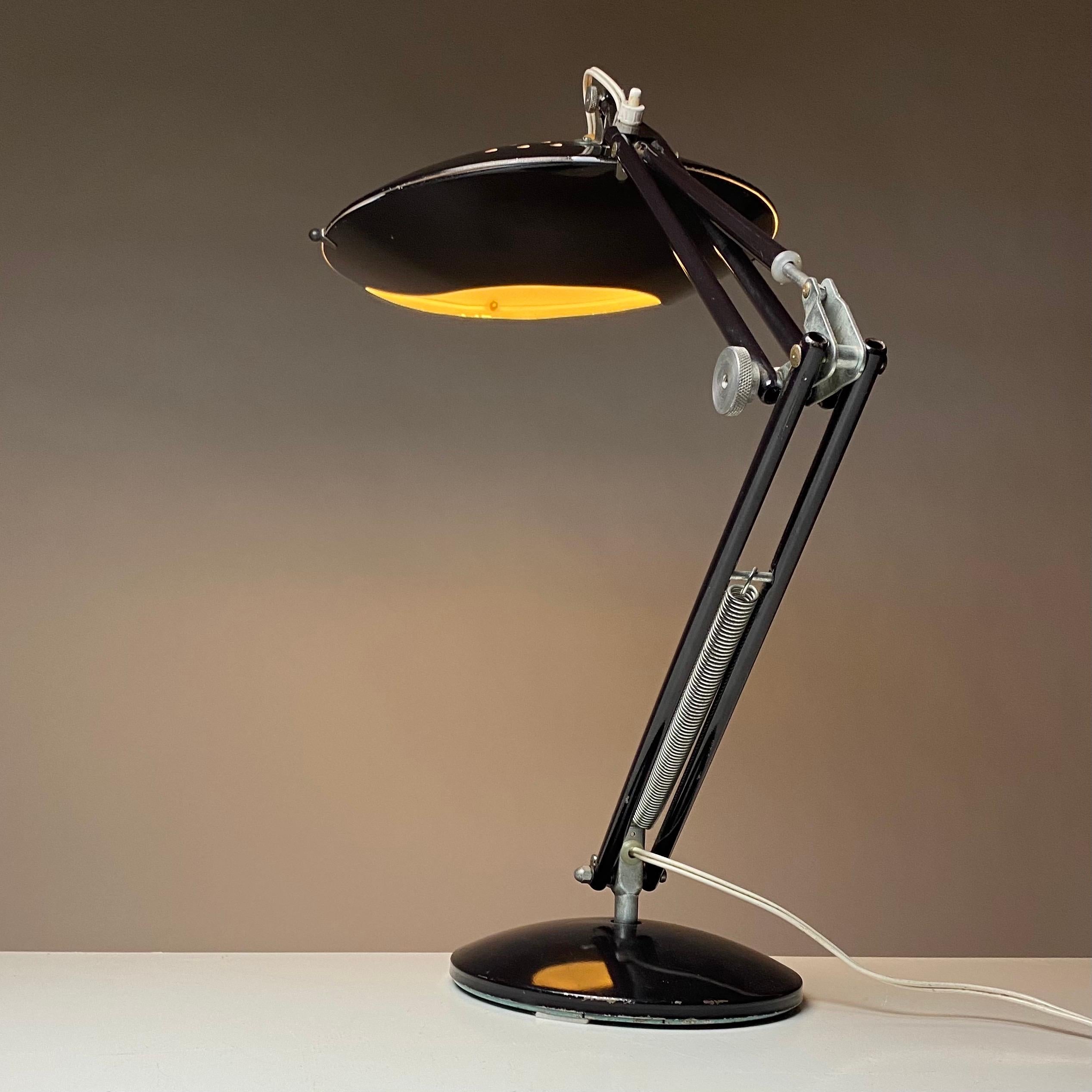 Now here is something for you who are looking for rare cool collectables or just want something no one else has. 

Aluminor desk lamp french design with both treads from atomic and space age and in the high quality which Aluminor has always been