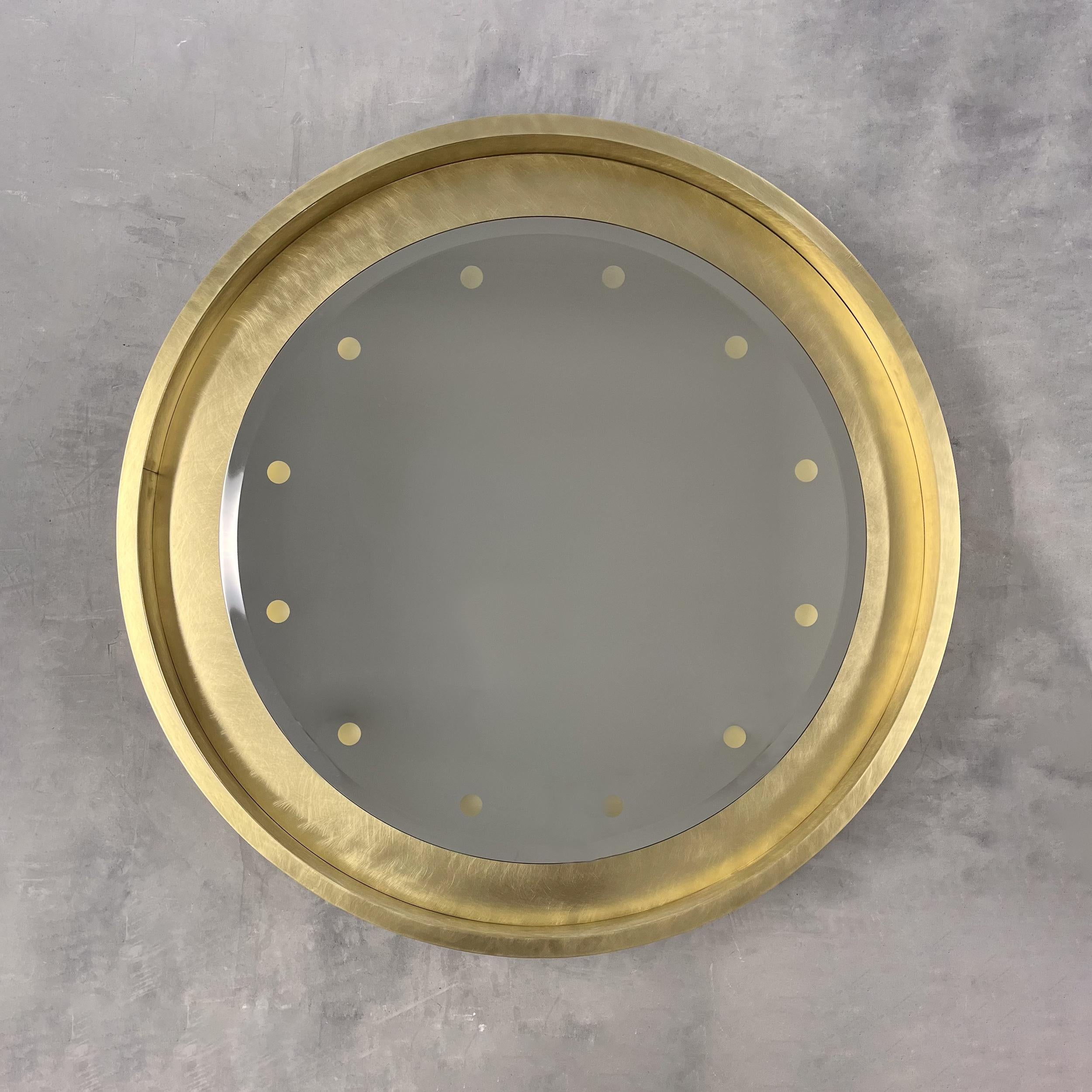 Special edition Orbis™ round bevelled mirror with a floating reflective handcrafted brushed brass frame frame and bespoke illumination.

This special edition of a classic Alguacil & Perkoff Orbis™ showcases an impressive attention to detail as well