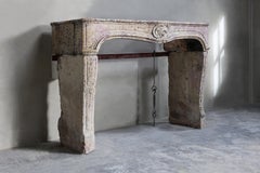 Antique Fireplace sculptured in Burgundy Stone