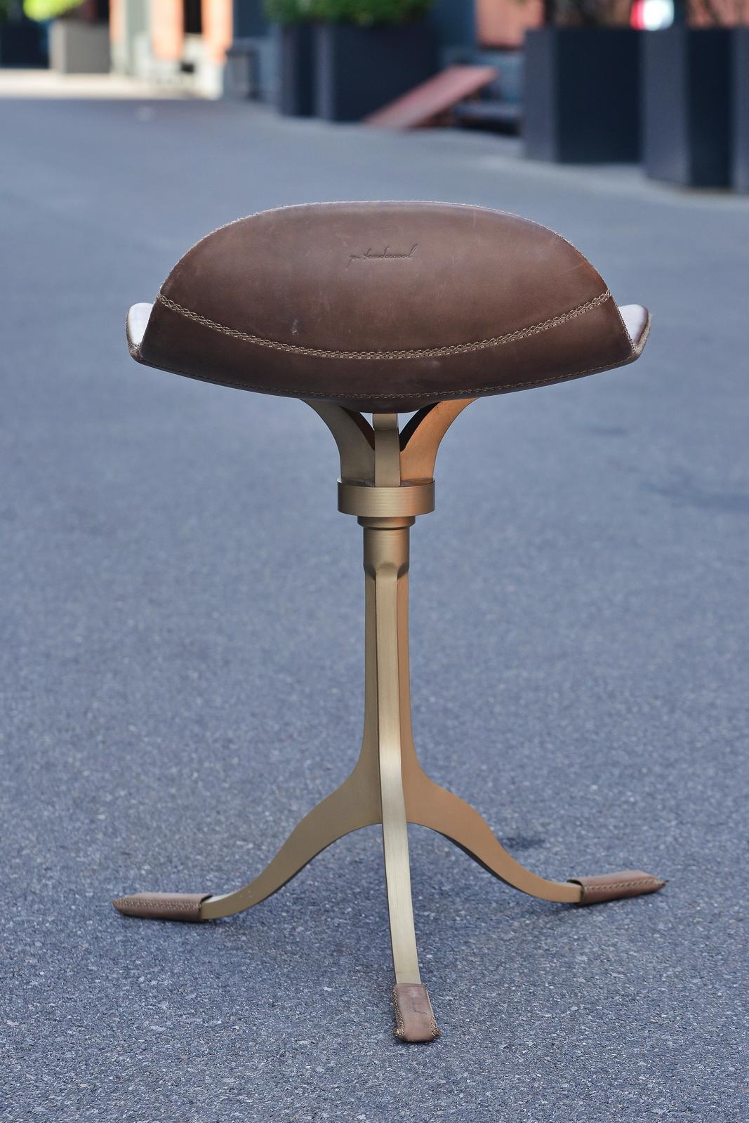 Model: PT48 Stool with swivel  in sand cast brass base
Seat: Leather
Seat color: Leather of your choice 
Base: PT48 base, with swivels and hand cast brass
Base finish: Golden sand 
Dimensions: 52 x 50 x 66 cm (seat height 54cm)
(W x D x H) 20.5 x