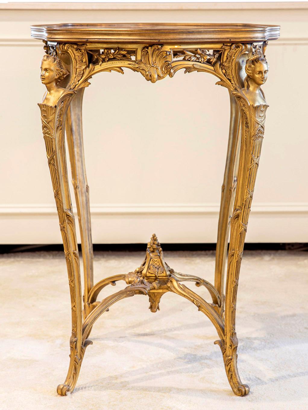 A Special Late 19th Century Louis XV Style Gilt Bronze Marble Top Side Table By Maison Millet

Maison Millet

The shaped breche violette marble top above the pierced bronze floral frieze, the angles headed by very fine male and female espagnolettes
