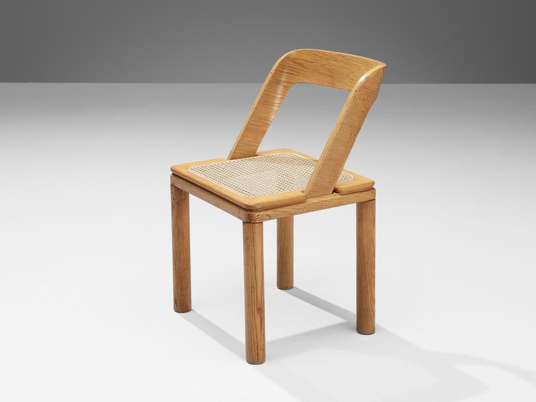 Special listing for APD: RB Rossana, set of two dining chairs, ash, cane, Italy, 1960s.

Italian furniture company designed these chairs, featuring a streamlined design with an open construction. The backrest is comprised of a curved frame