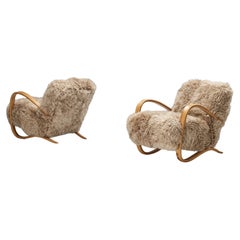 Special listing for C: Two Jindrich Halabala Lounge Chairs in Beige Sheepskin