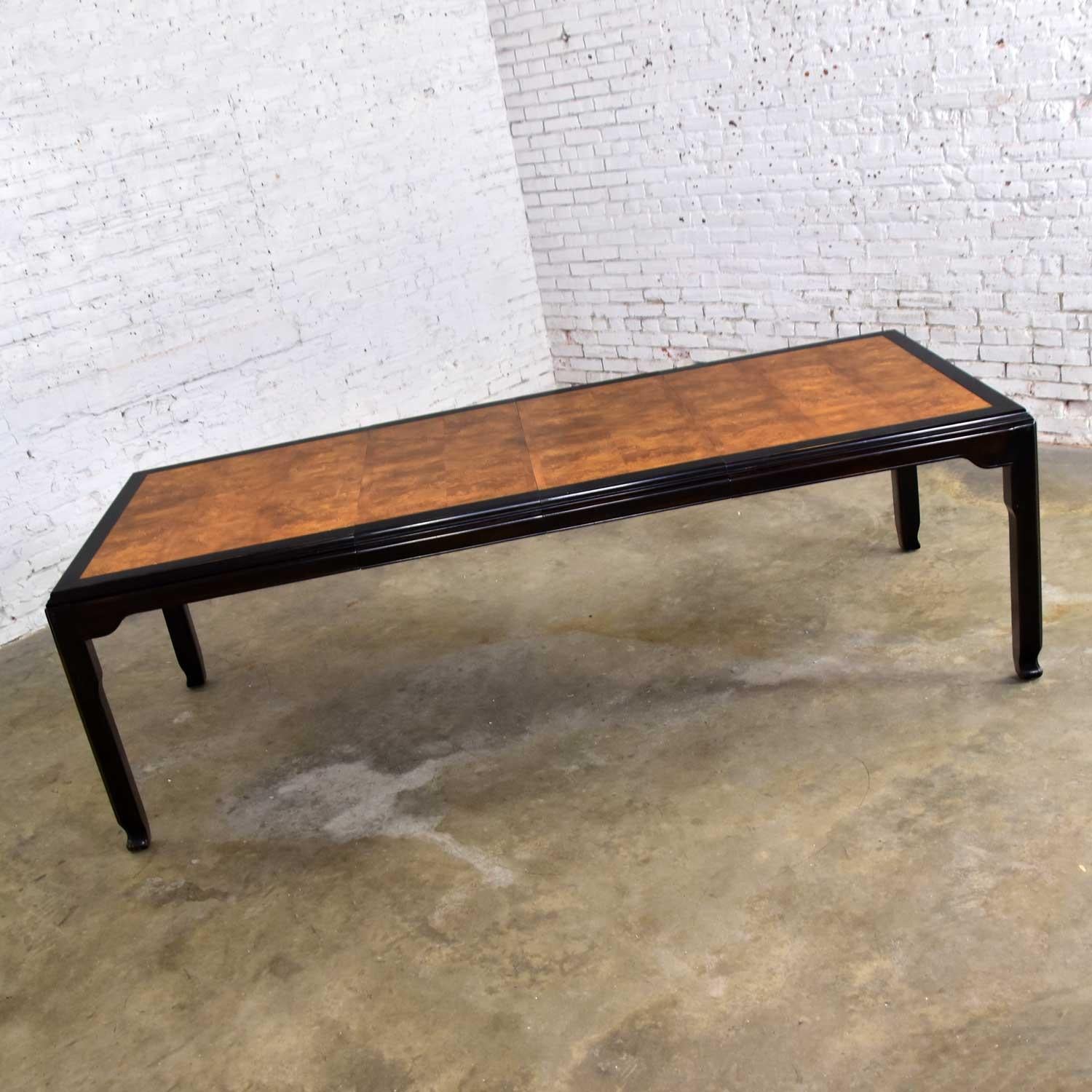 TABLE
Fabulous Hollywood Regency Chinoiserie dining table designed by Raymond K. Sobota for his Chin Hua Collection for Century Furniture. Comprised of an ebonized dark brown frame with burl wood inset. Beautiful vintage condition. The framework of