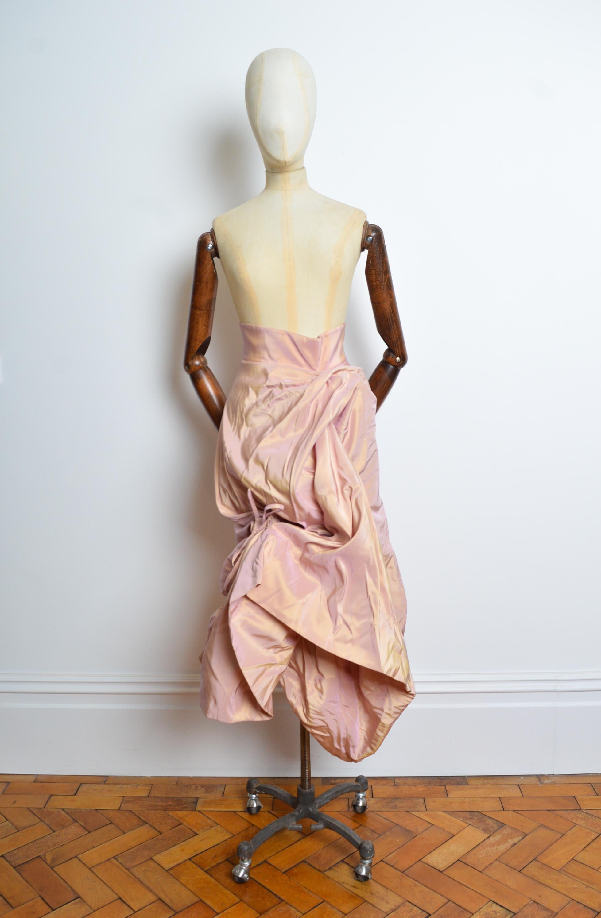 Special Order Vivienne Westwood Haute Couture Pink Taffeta Structured Skirt circa 1994. 
A Superb, One of a Kind Vivienne Westwood made to order structured ‘Gold Label’ skirt crafted from a dusty pink and gold taffeta. This extraordinary garment