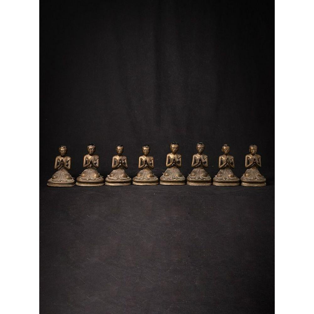 Material: bronze
Measures: 18 cm high 
13,2 cm wide and 13 cm deep
Weight: 9.70 kgs
Mandalay style
Namaskara mudra
Originating from Burma
19th century
Complete set of 8 monk statues, were original placed around a larger Buddha statue
It is