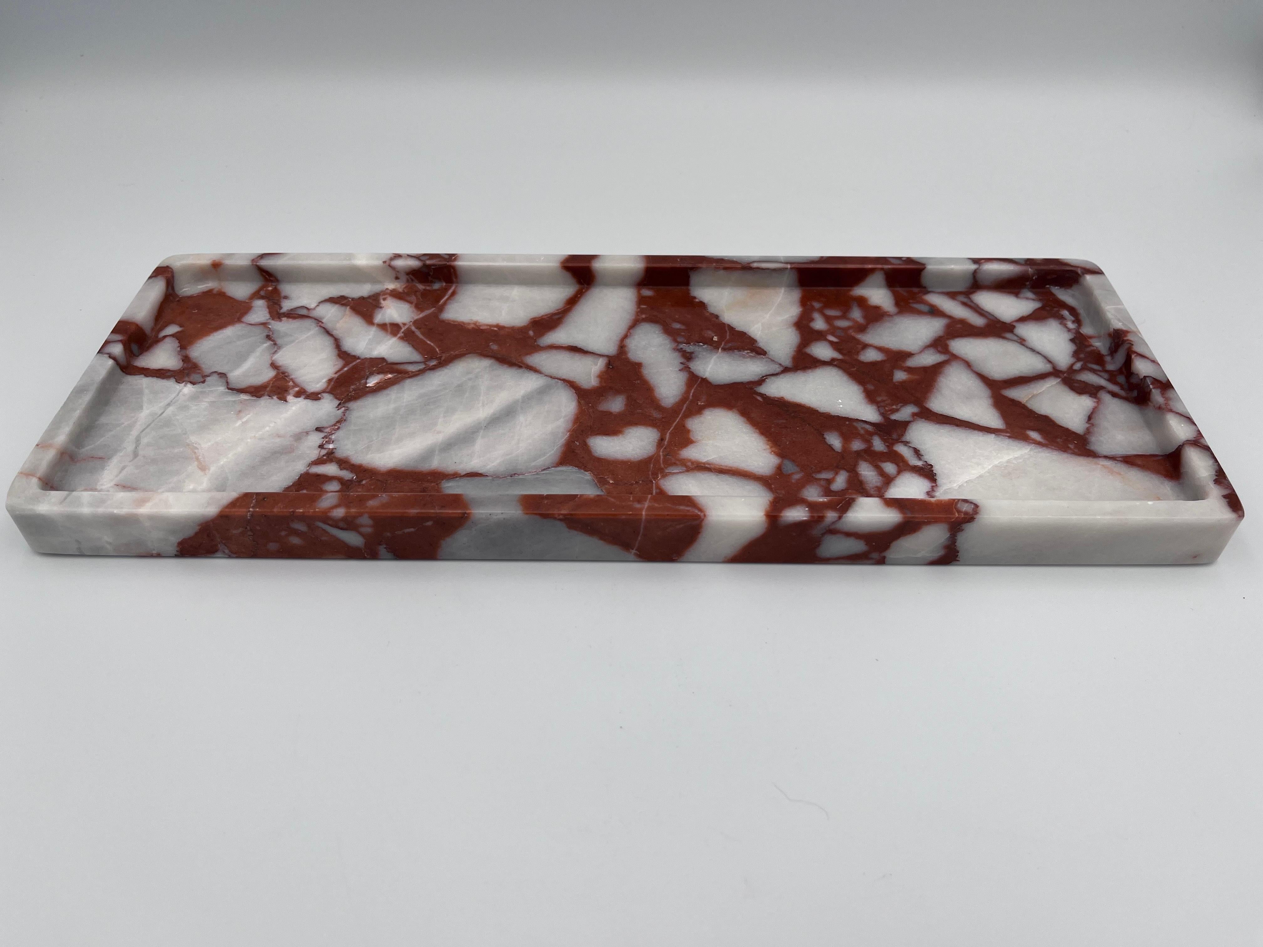 Specimen Calcutta Red Marble Rectangular Tray / Vide Poche / Coin Dish 

A luxurious specimen Calcutta Red marble tray, exquisitely carved from a single solid block of marble, this rectangular tray measures 4.88” D × 12.63” W × 0.75” H and features