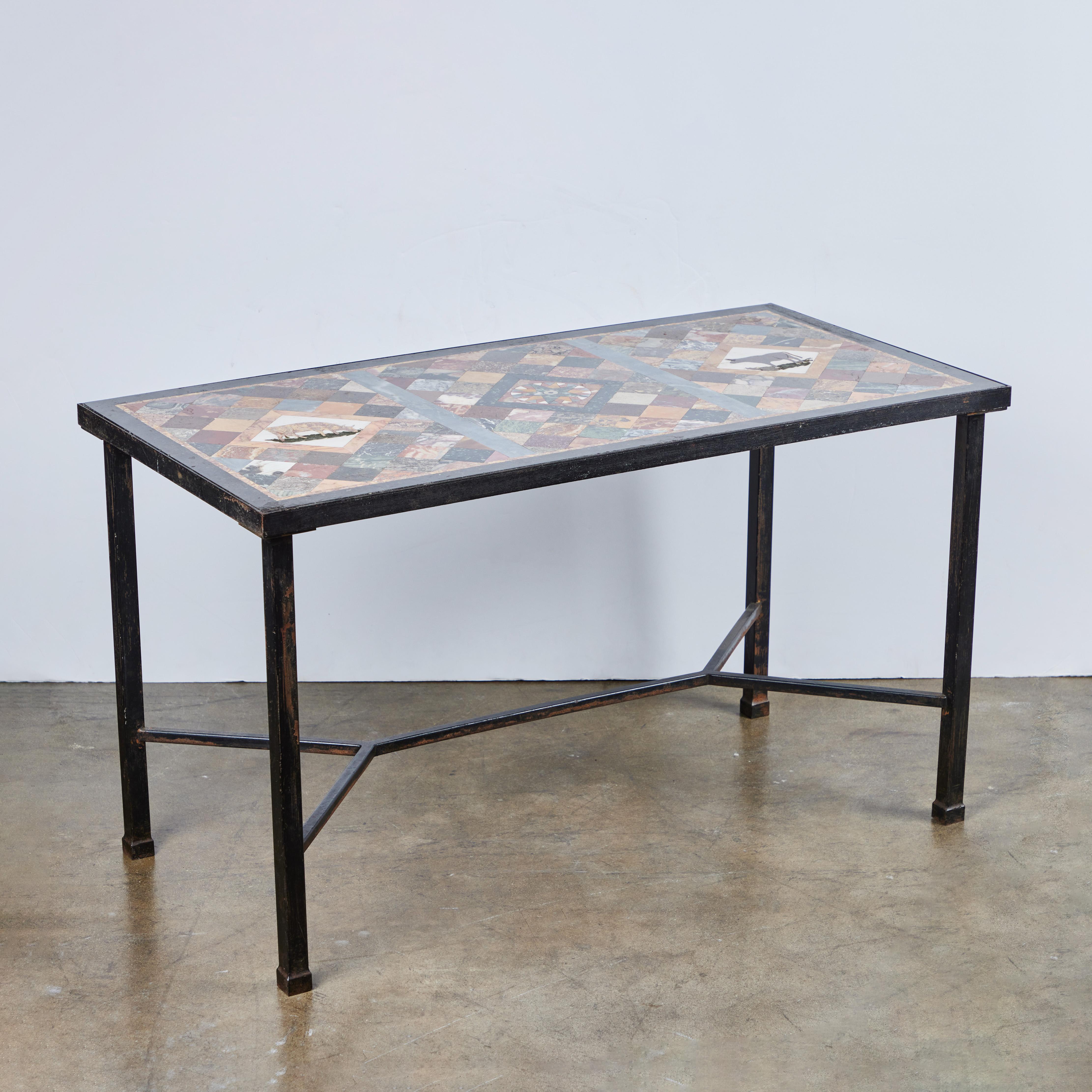 A circa 1940s specimen marble top featuring bulls and a center star pattern set in a contemporary iron base.