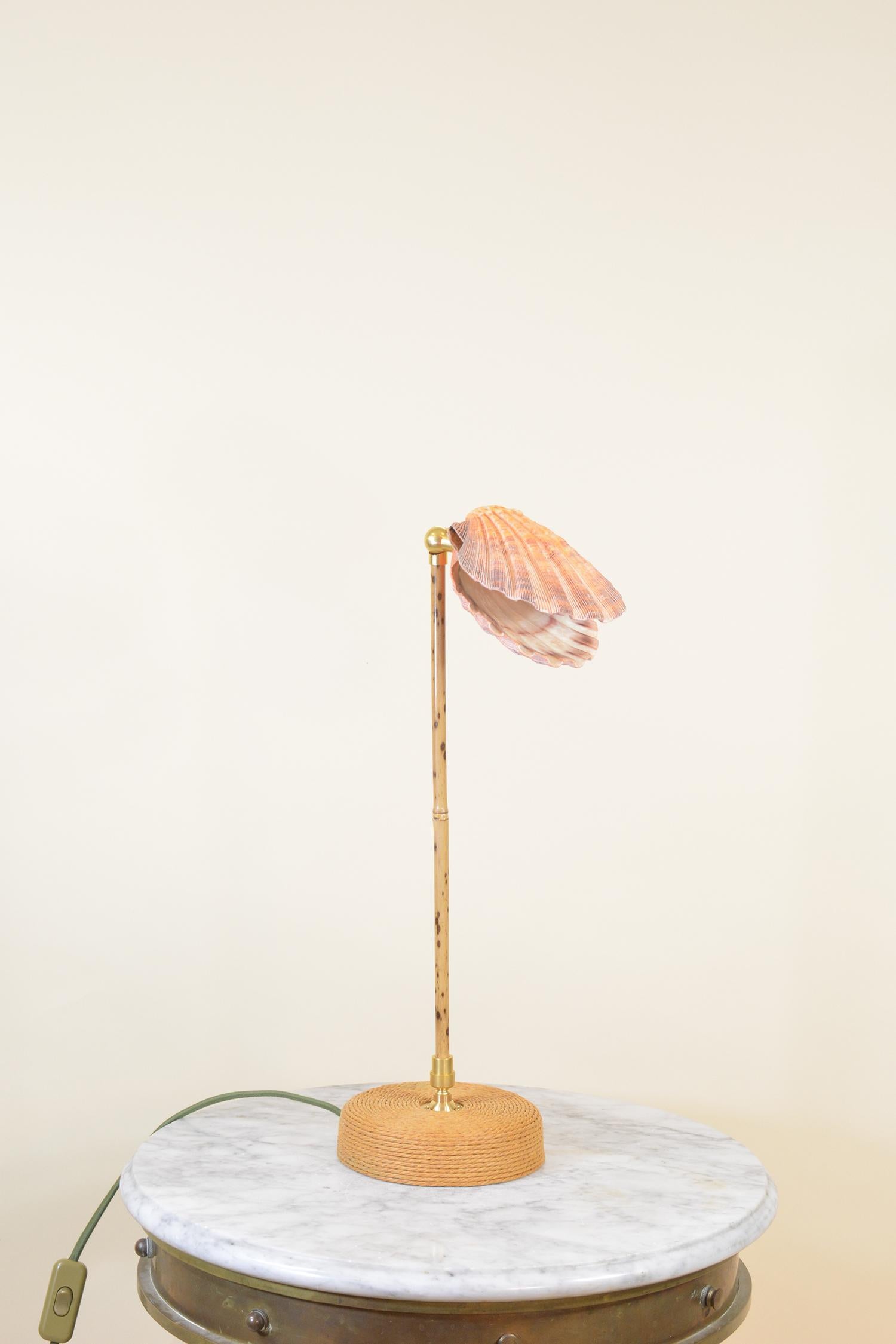 Introducing the Ligurian Summer Collection, a sophisticated family of handmade fixtures in natural sea shell, coiled leather, marble, and bamboo, inspired by the faded splendor of the northern Italian coast.

A fully articulated cousin to the