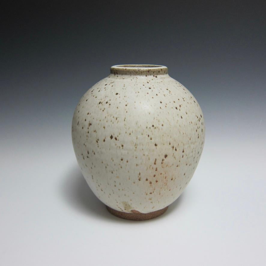 Wheel Thrown Speckled White Vessel by Jason Fox.

A Southern Californian for over half his life, Contemporary Ceramic Artist Jason Fox draws upon his classical education in Architecture and Art History as well as his love of surfing and the ocean.