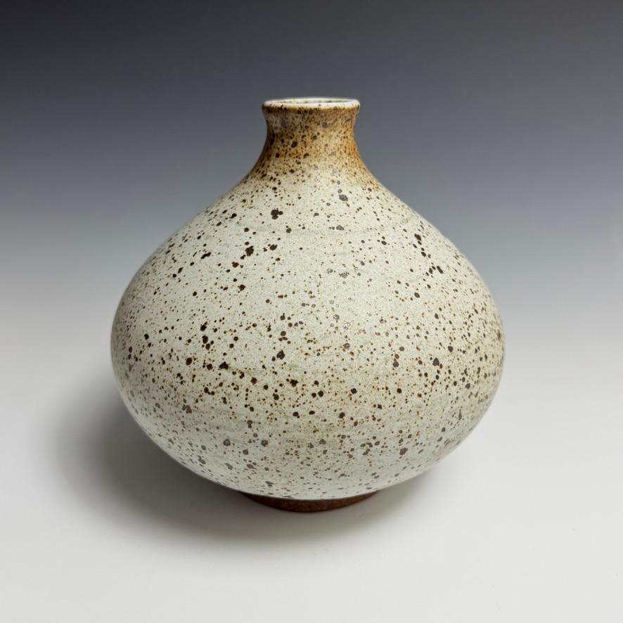 Speckled White Flower Bottle by Jason Fox.

A Southern Californian for over half his life, Contemporary Ceramic Artist Jason Fox draws upon his classical education in Architecture and Art History as well as his love of surfing and the ocean. He