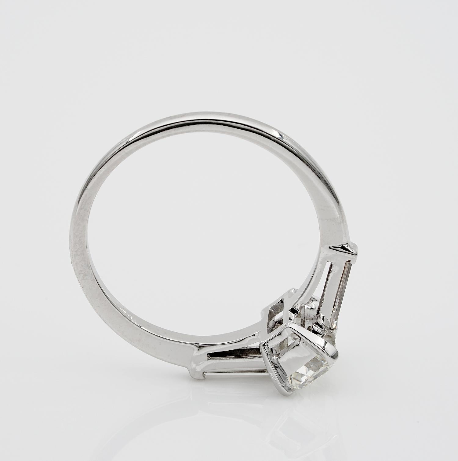 Spectacular 1.21 Carat Emerald Cut Diamond G VVS1 Tapered Diamond Side Ring For Sale 1