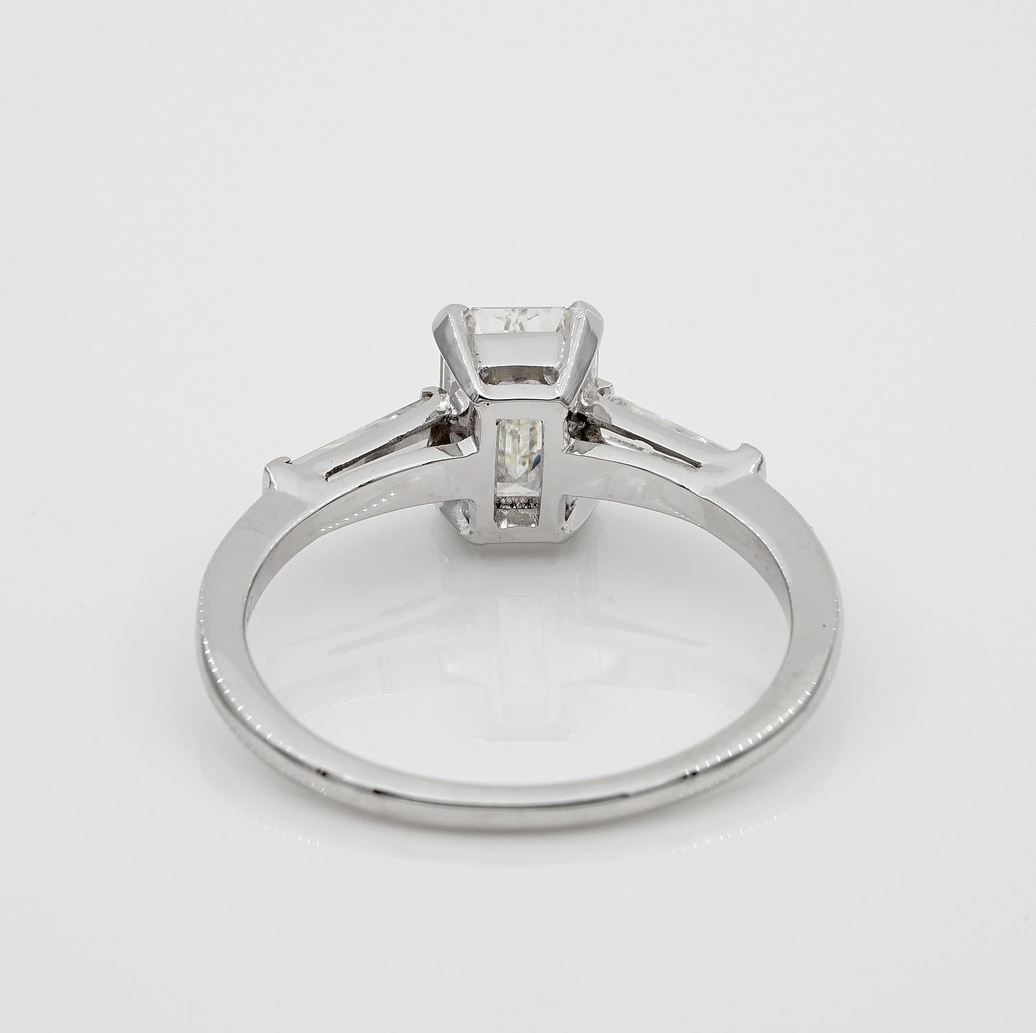 Spectacular 1.21 Carat Emerald Cut Diamond G VVS1 Tapered Diamond Side Ring For Sale 2