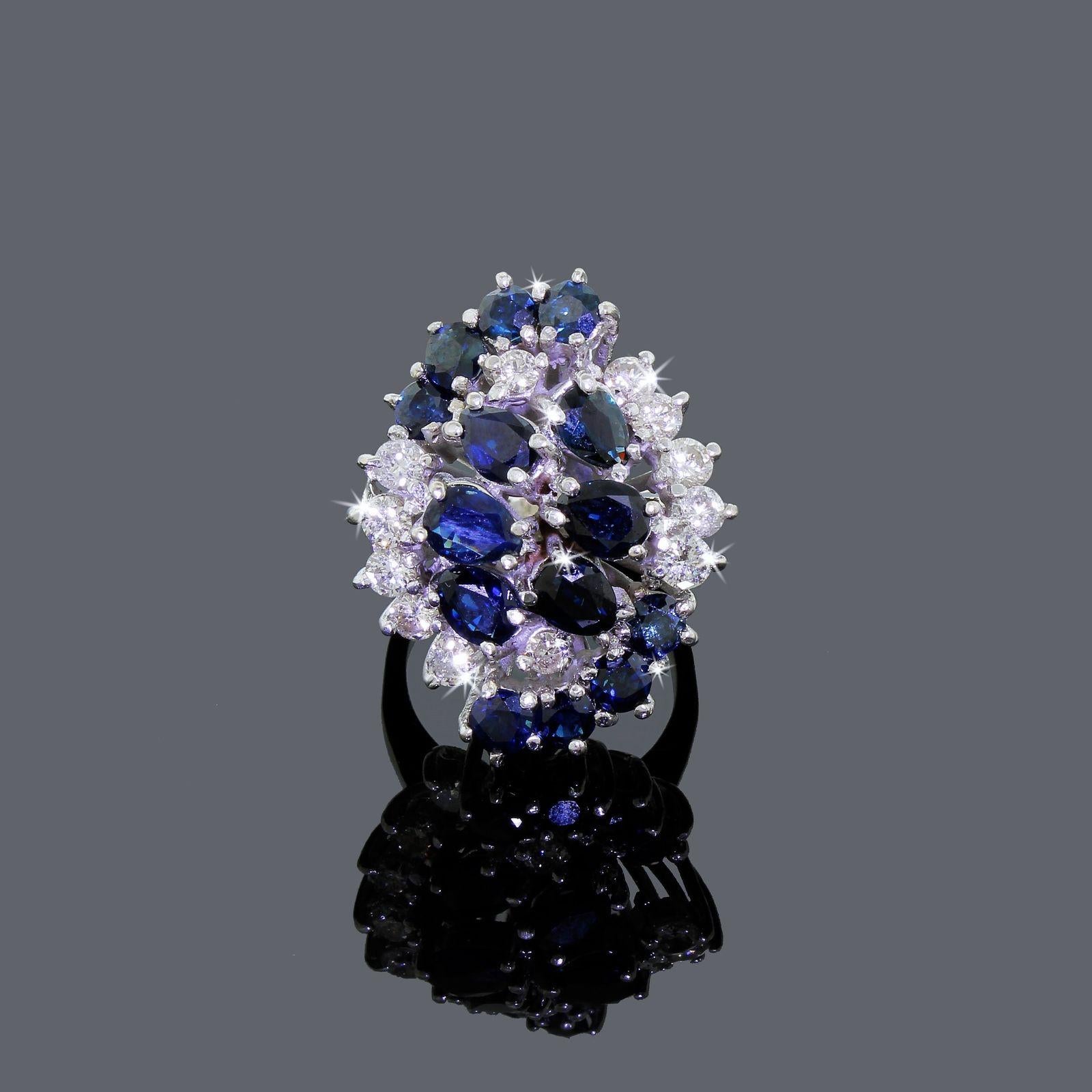 Lady's spectacular 14k white gold Diamond & Sapphire cocktail cluster ring set, custom made and truly spectacular not to mention eye catching.
All the stones sit elevated on a basket style cage, they are almost half an inch from the finger when worn